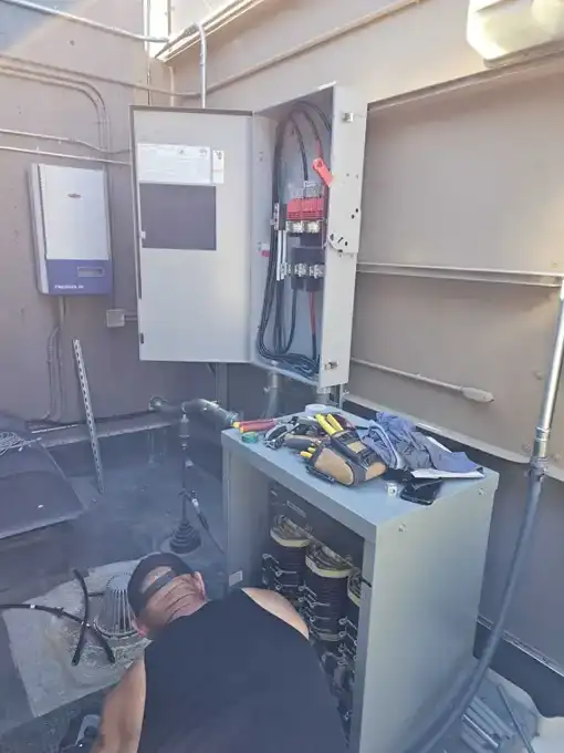 Transformer and disconnect set in the rooftop equipment room.